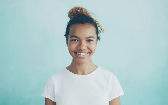 Young woman with a bright, confident smile